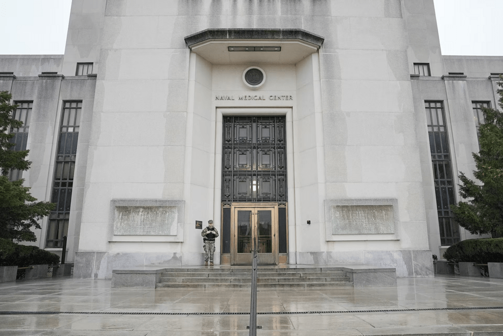 A guard stands by an entrance, on the day of U.S. President Donald Trump's annual physical exam at Walter Reed National Military Medical Center in Bethesda, Maryland,. U.S. April 11, 2025. REUTERS/Ken Cedeno