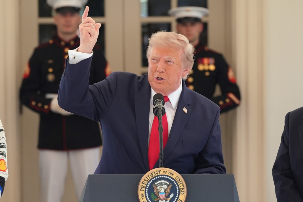 President Donald Trump speaks on West Executive Drive at the White House during a showcase for the upcoming Freedom 250 Grand Prix auto race, Monday, July 13, 2026, in Washington. (AP Photo/Alex Brandon)