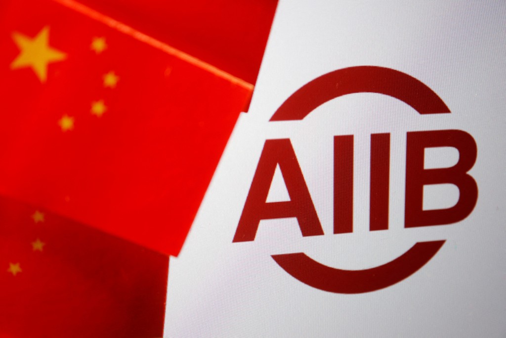 Flags of China are displayed next to the logo of Asian Infrastructure Investment Bank (AIIB) in this illustration picture taken June 15, 2023. REUTERS
