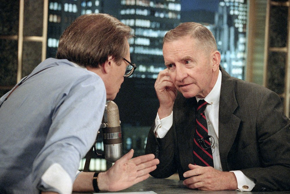 In this July 18, 1992 file photo, Larry King, left, talks with Texas billionaire Ross Perot during a commercial break in the live broadcast of CNN's 'Larry King Live' in New York.