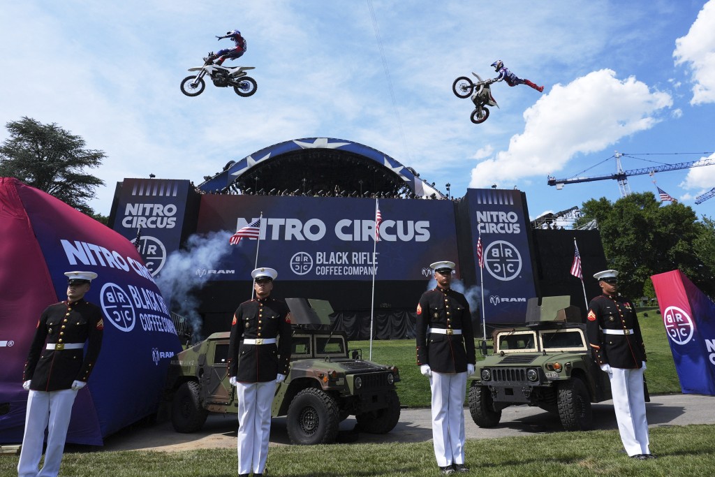 Stunt performers do a motorcycle jump, ahead of Sunday's UFC Freedom 250 fights on the South Lawn of the White House in Washington, DC, on June 13, 2026. (AFP)