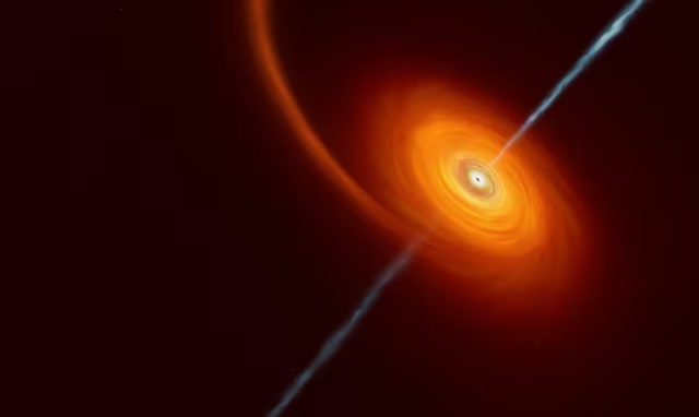 This undated artist’s impression illustrates how it might look when a star approaches too close to a black hole, where the star is squeezed by the intense gravitational pull of the black hole. Some of the star’s material gets pulled in and swirls around the black hole forming the disc that can be seen in this image. In rare cases, such as this one, jets of matter and radiation are shot out from the poles of the black hole. ESO/M.Kornmesser/Handout via REUTERS