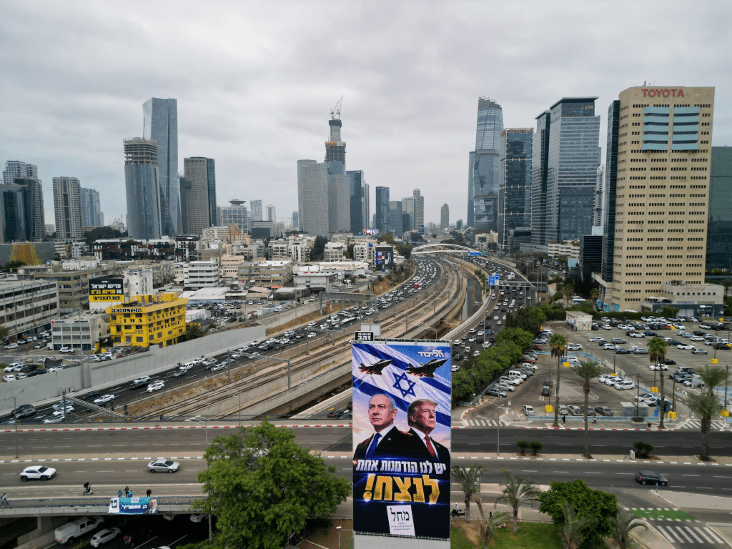 A drone view of an election campaign display for Israeli Prime Minister Benjamin Netanyahu's Likud party, depicting Netanyahu and US President Donald Trump with the words in Hebrew "we have one opportunity to win!", the day before Israel's national election, in Tel Aviv, Israel, October 26, 2026. REUTERS/Amir Cohen