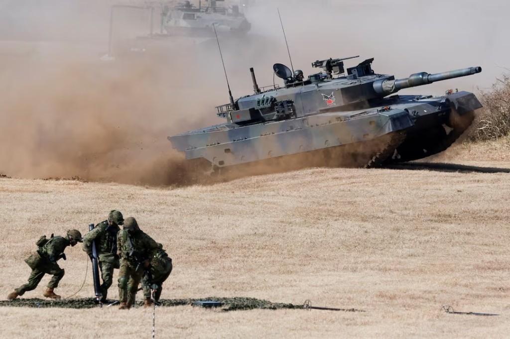 Type 10 tanks operate during an annual New Year military drill by the Japanese Ground Self-Defense Force 1st Airborne Brigade at Narashino exercise field in Funabashi, east of Tokyo, Japan, January 11, 2026. REUTERS/Kim Kyung-Hoon/File Photo