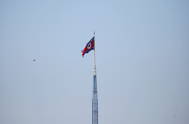 A North Korean flag flutters on top of a tower at the propaganda village of Gijungdong in North Korea, in this picture taken near the truce village of Panmunjom, South Korea, August 26, 2017. REUTERS/Kim Hong-Ji 
