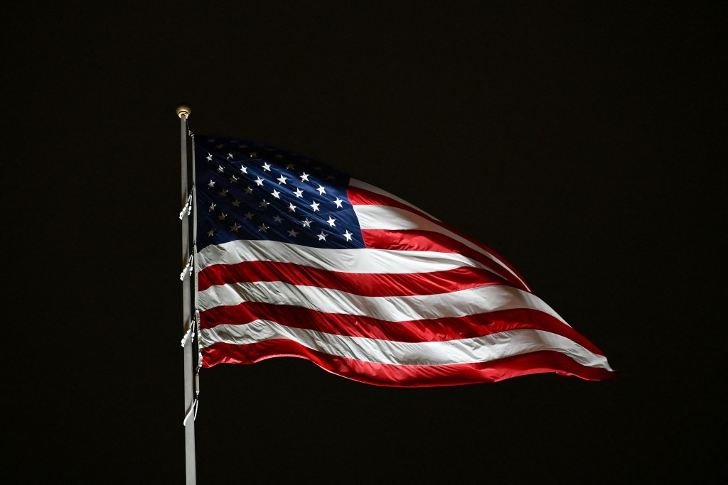 The US flag flutters on the South Lawn of the White House in Washington, DC, on October 10, 2026. (Photo by Alex WROBLEWSKI / AFP)