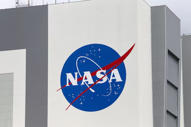 The NASA logo is seen at Kennedy Space Center ahead of the NASA/SpaceX launch of a commercial crew mission to the International Space Station in Cape Canaveral, Florida, U.S., April 16, 2021. REUTERS/Joe Skipper/File Photo