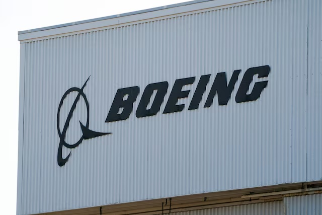 A Boeing sign sits on a building near Boeing Field, as trade tensions escalate over U.S. tariffs with China, in Seattle, Washington, U.S. April 22, 2025. REUTERS/David Ryder/File Photo