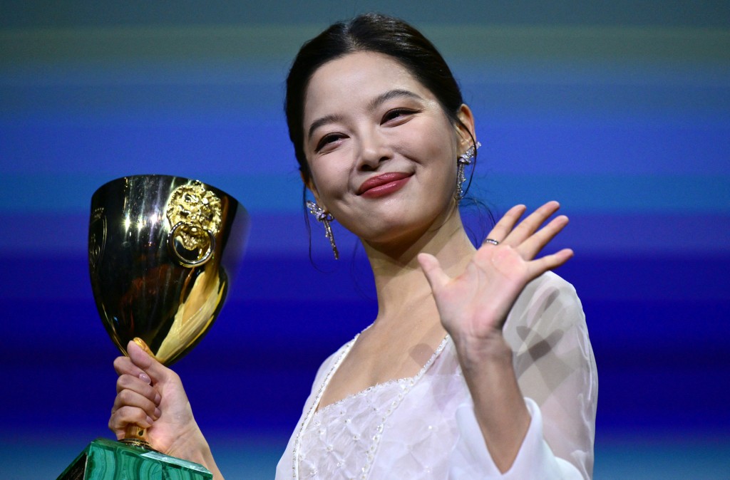 Chinese actress Xin Zhilei poses with the Coppa Volpi for Best Actress she received. (AFP)