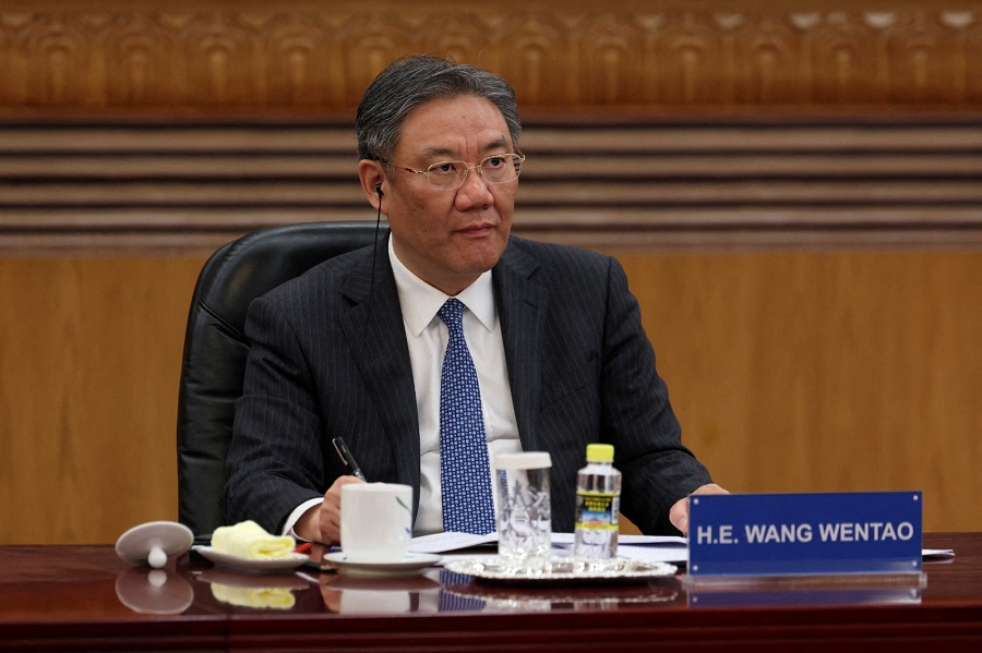 Wang Wentao attends a meeting with global business leaders at the Great Hall of the People in Beijing in March. Photo by REUTERS
