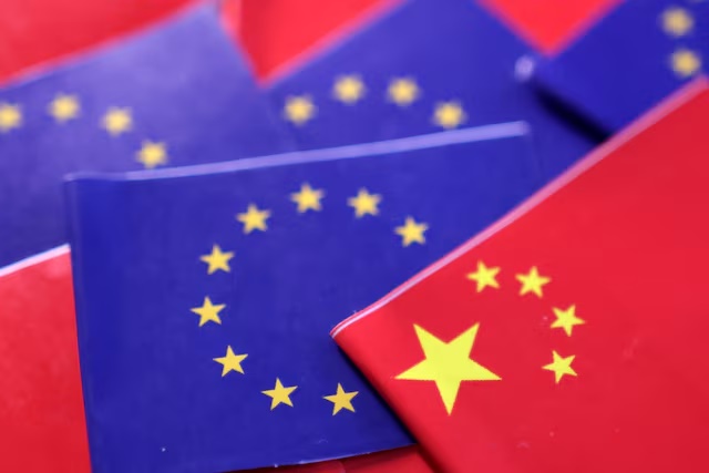 EU and Chinese flags are seen in this illustration taken, March 20, 2025. REUTERS/Dado Ruvic/Illustration