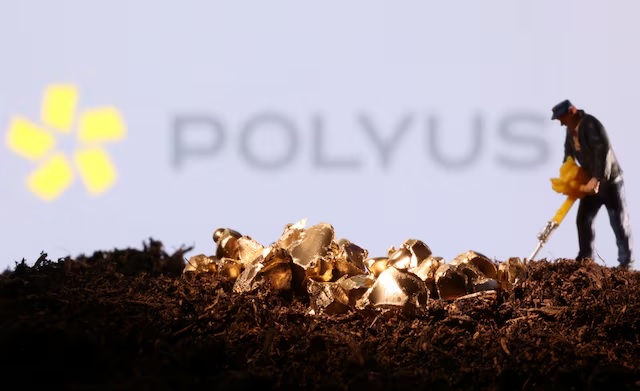 A small toy figure and gold imitation are seen in front of the Polyus logo in this illustration taken November 19, 2021. (Reuters) A small toy figure and gold imitation are seen in front of the Polyus logo in this illustration taken November 19, 2021. (Reuters)