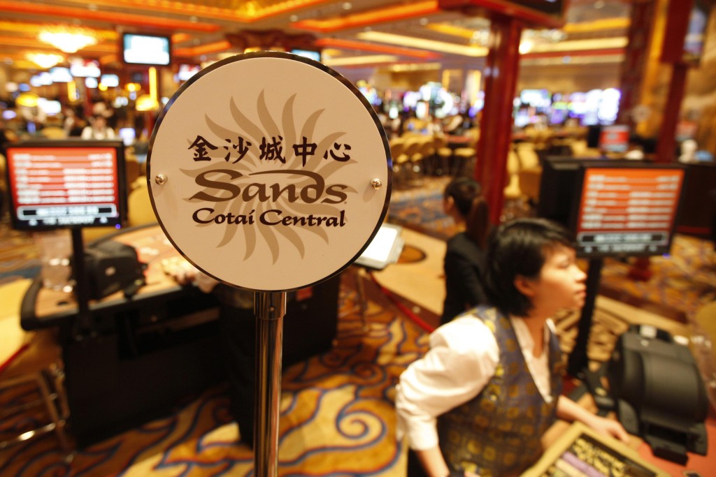 A logo of Sands Cotai Central is seen on a gaming table inside a casino on the opening day of the Sands Cotai Central, Sands' newest integrated resort in Macau in this April 11, 2012 file photo. Reuters
