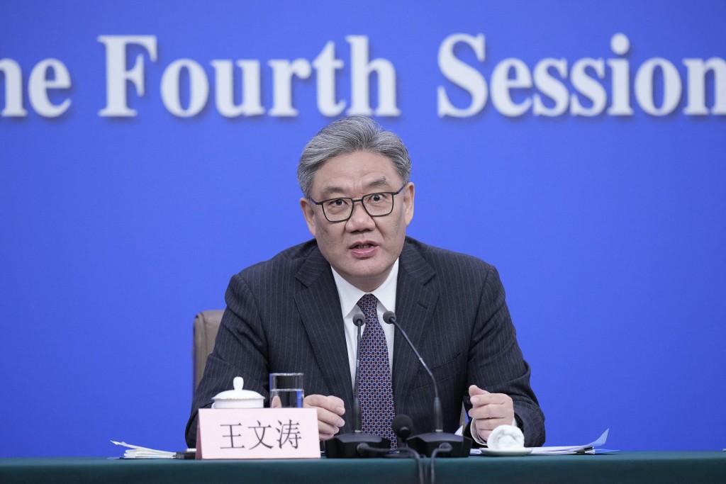 China's Minister of Commerce Wang Wentao attends a new conference on economy for the fourth session of the 14th National People's Congress (NPC) in Beijing on March 6, 2026. AFP