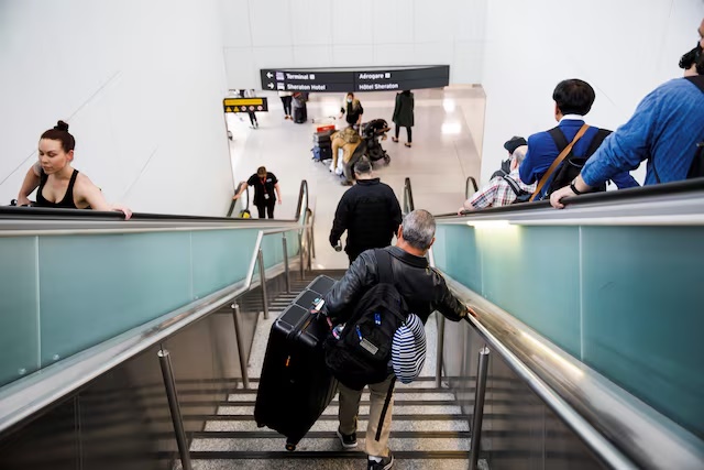 Travellers make their way to the departures terminal at the start of the Victoria Day holiday long weekend at Toronto Pearson International Airport in Mississauga, Ontario, Canada, May 20, 2022. REUTERS/Cole Burston/File Photo Travellers make their way to the departures terminal at the start of the Victoria Day holiday long weekend at Toronto Pearson International Airport in Mississauga, Ontario, Canada, May 20, 2022. REUTERS/Cole Burston/File Photo