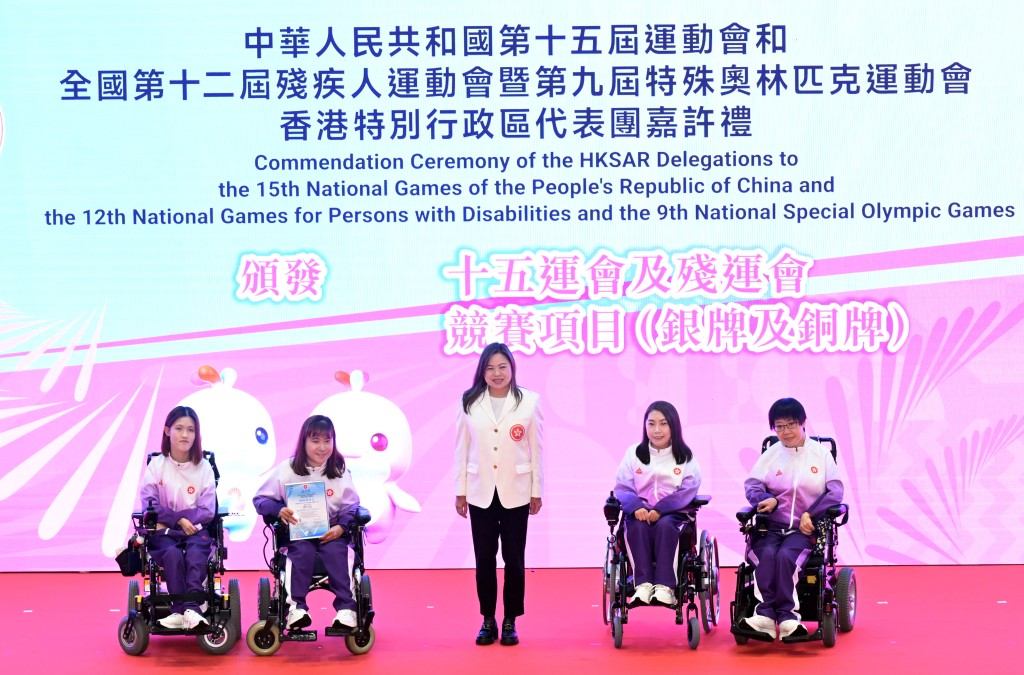 Rosanna Law presents certificates of commendation to boccia athletes including Ho Yuen-kei, second right.