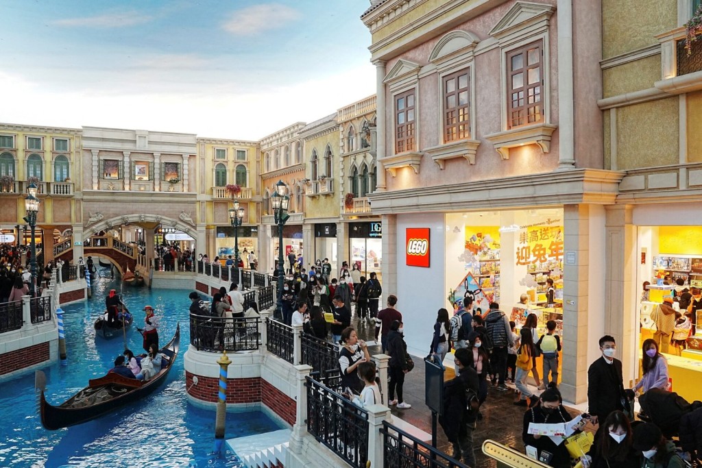 Visitors shop at the Grand Canal shop inside the Venetian Macao hotel. Reuters