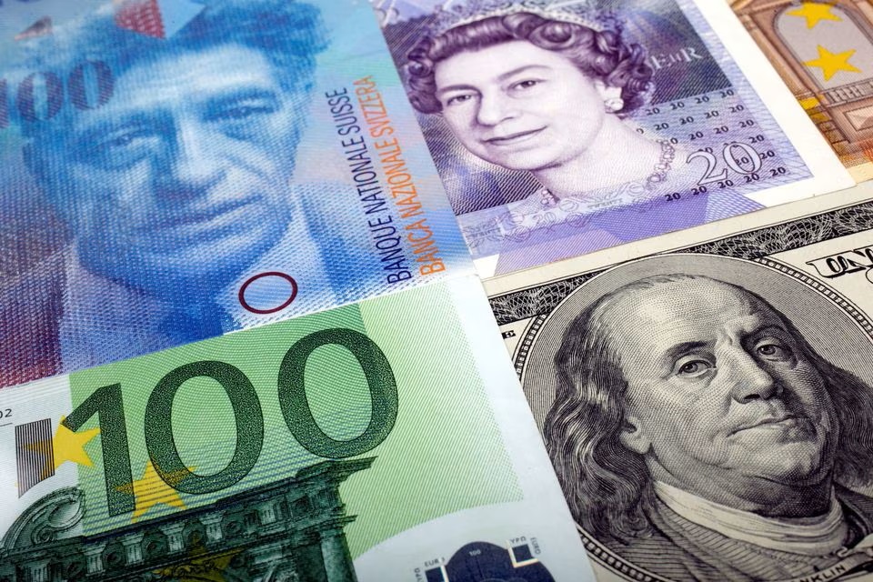 A picture illustration of U.S. dollar, Swiss Franc, British pound and Euro bank notes. (Reuters) A picture illustration of U.S. dollar, Swiss Franc, British pound and Euro bank notes. (Reuters)