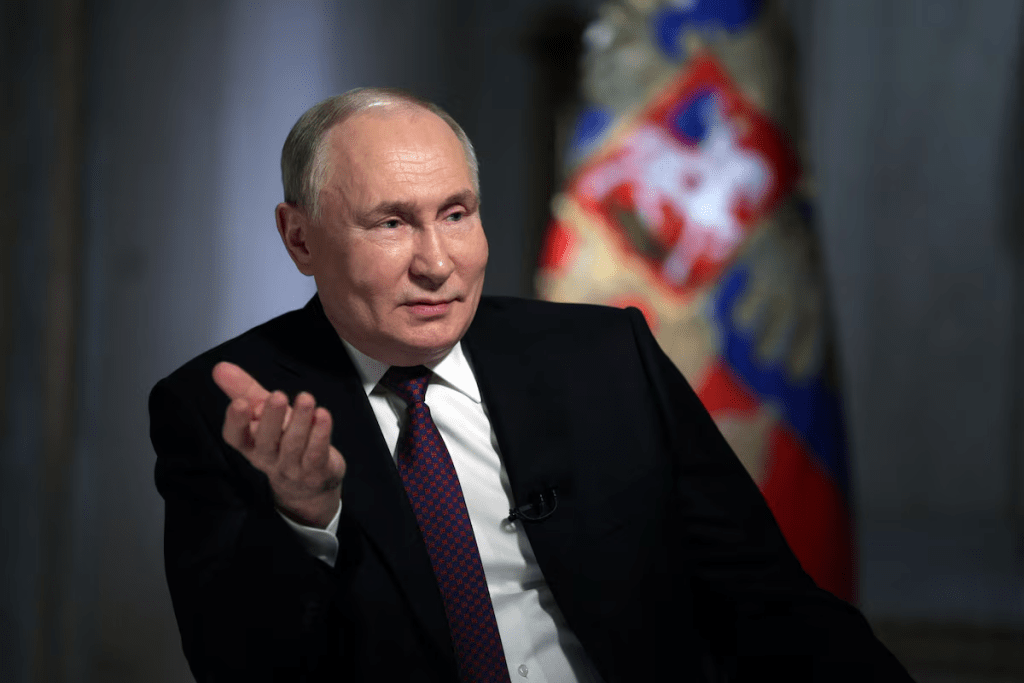 Russian President Vladimir Putin speaks with Director General of Rossiya Segodnya media group Dmitry Kiselyov during an interview in Moscow, Russia, March 12, 2024. Sputnik/Gavriil Grigorov/Pool via REUTERS