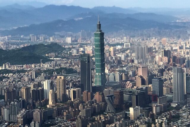 Nan Shan Plaza (L) and Taiwan's landmark building Taipei 101 are pictured through the window of an airplane, in Taipei, Taiwan August 19, 2018.