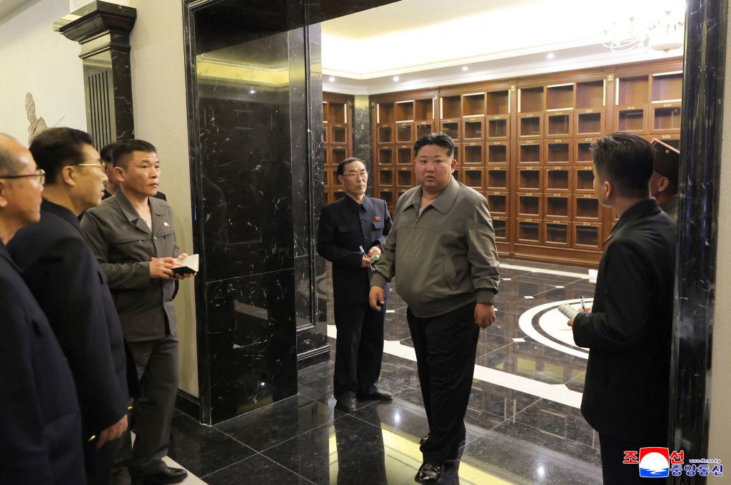 This undated picture released by North Korea's official Korean Central News Agency (KCNA) on April 3, 2026 shows North Korean leader Kim Jong Un (C) inspecting the Memorial Museum of Combat Feats at the Overseas Military Operations under construction in Pyongyang. (Photo by KCNA VIA KNS / AFP)