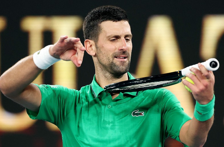 Novak Djokovic celebrates his milestone. AFP