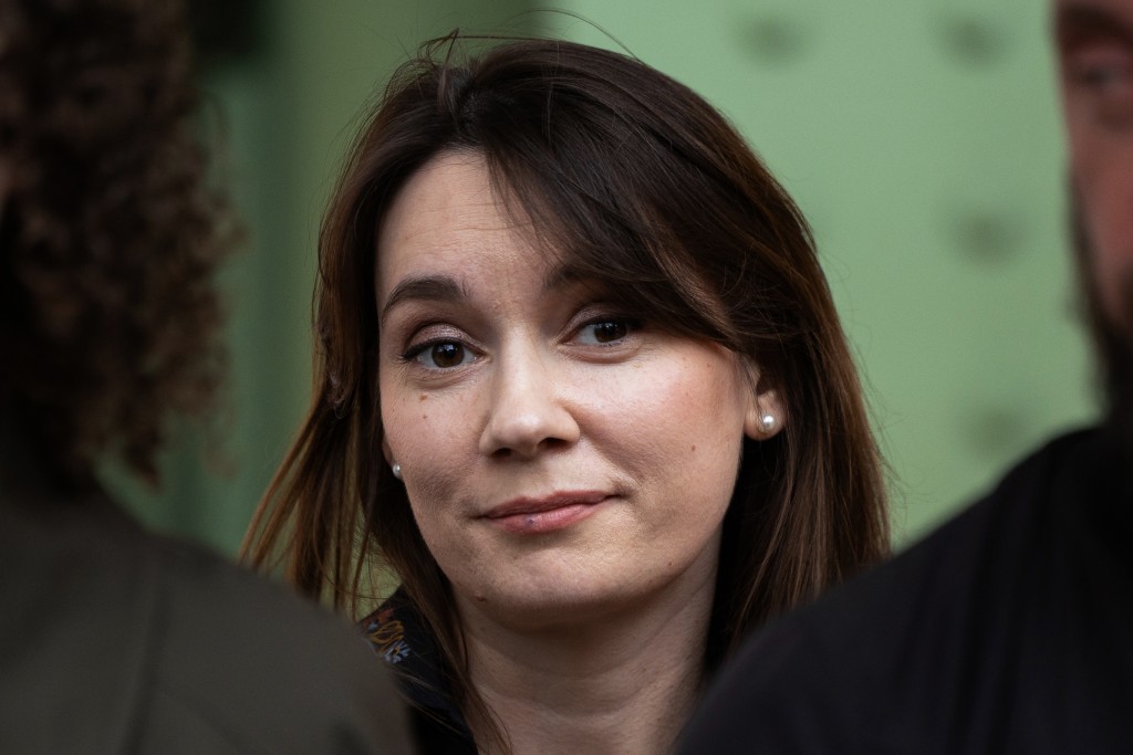 Xenia Fedorova, former director of the French version of Russian state-run foreign language channel RT, which was banned in France after the Russian invasion of Ukraine, reacts as activists of the organization "For Ukraine, for their freedom and ours" stage a protest against her presence to promote her book untitled "Bannie" ("Banned"), at the stand of French publishing house Fayard during the "Festival du Livre de Paris 2025" book fair at the Grand Palais venue in Paris on April 12, 2025.