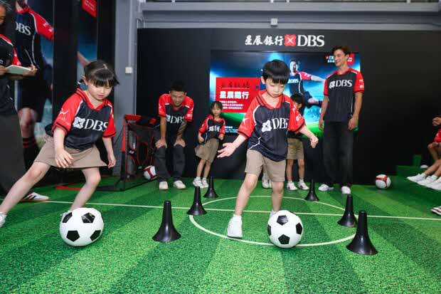 Tung Wah Group of Hospitals junior football fans' interactive experience with Hong Kong representative football team players Matthew Orr and Philip Chan on July 14. DBS BANK (HONG KONG) Tung Wah Group of Hospitals junior football fans' interactive experience with Hong Kong representative football team players Matthew Orr and Philip Chan on July 14. DBS BANK (HONG KONG)