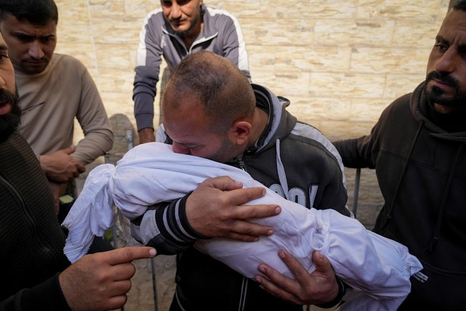 A Palestinian man holds the body of his 11 month-old nephew Mohammad Shaban, killed in an Israeli army airstrikes at the Al-Ahli Hospital in Gaza City, Tuesday, March 18, 2025. (AP Photo/Abdel Kareem Hana) A Palestinian man holds the body of his 11 month-old nephew Mohammad Shaban, killed in an Israeli army airstrikes at the Al-Ahli Hospital in Gaza City, Tuesday, March 18, 2025. (AP Photo/Abdel Kareem Hana)