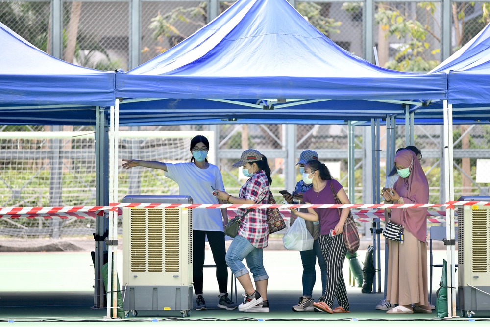 Helpers queue to take virus tests. Newly arrived maids may be sent to isolation camp at Penny's Bay. Sing Tao, Reuters Helpers queue to take virus tests. Newly arrived maids may be sent to isolation camp at Penny's Bay. Sing Tao, Reuters