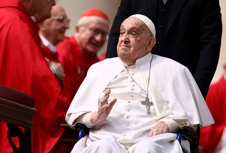 Pope Francis greets cardinals as he unexpectedly appears during the Palm Sunday Mass in Saint Peter's Square at the Vatican, April 13, 2025. (Reuters)
