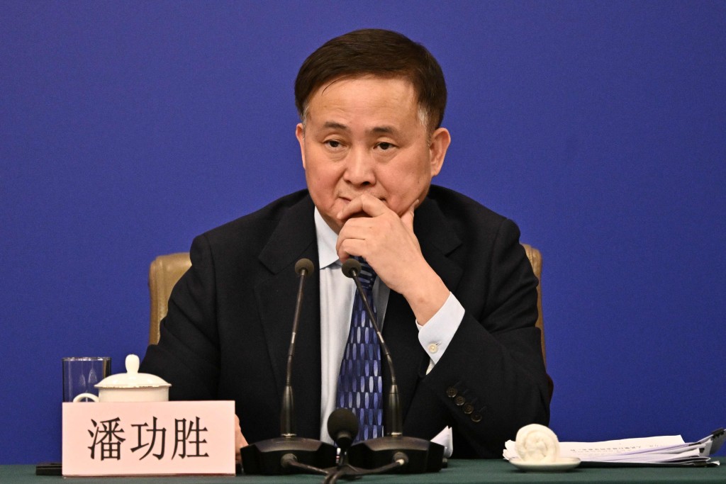 Pan Gongsheng, Governor of People Bank of China, attends a press conference during the second session of the 14th National People's Congress (NPC) in Beijing on March 6, 2025. (Photo by Pedro Pardo / AFP)