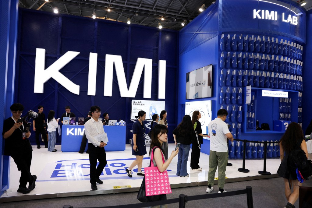 People walk past the Moonshot booth promoting its Kimi K3 AI model, during the World Artificial Intelligence Conference (WAIC) in Shanghai, China, July 17, 2026. REUTERS/Go Nakamura REFILE - ADDING INFORMATION