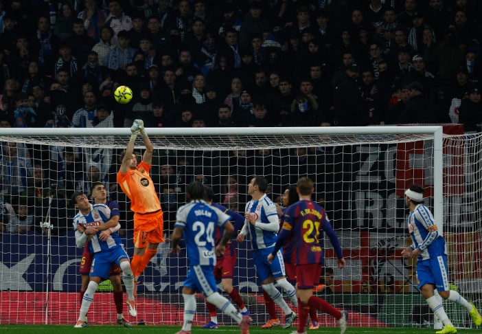 Barca goalkeeper Joan Garcia clears the ball during the match against Espanyol.  AP