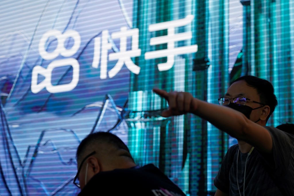 The logo of online video service operator Kuaishou Technology is seen at the China Digital Entertainment Expo and Conference, also known as ChinaJoy, in Shanghai, China July 30, 2021. Picture taken July 30, 2021. REUTERS