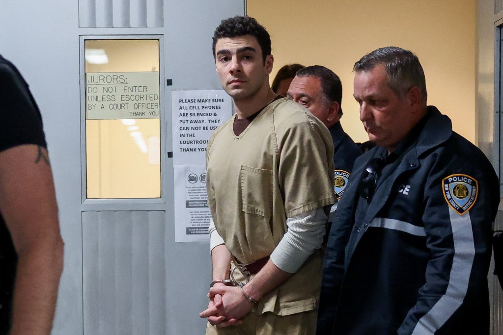 Luigi Mangione, the suspect in the killing of UnitedHealthcare chief executive Brian Thompson, is escorted by police officers as he leaves the courtroom at Manhattan Supreme Court on the day he appears on New York State murder and terrorism charges, in New York City, U.S., September 16, 2025. (Reuters)