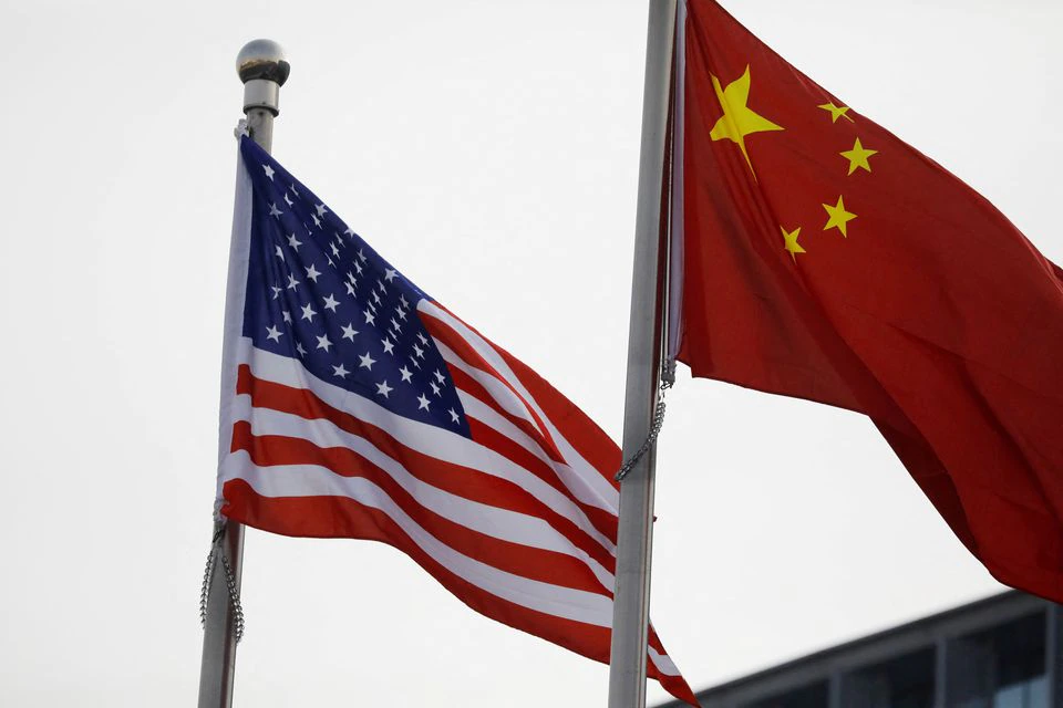 Chinese and U.S. flags flutter outside the building of an American company in Beijing, China. (Reuters) Chinese and U.S. flags flutter outside the building of an American company in Beijing, China. (Reuters)