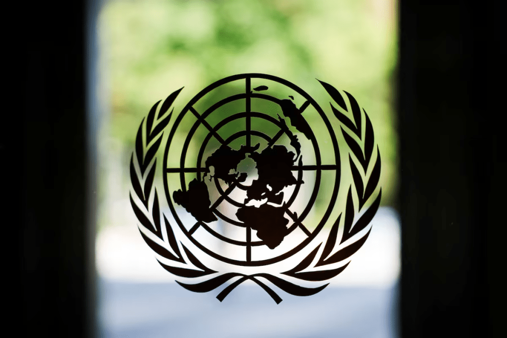 The United Nations logo adorns a window at U.N. headquarters in New York City, U.S., September 18, 2025. REUTERS/Jeenah Moon 