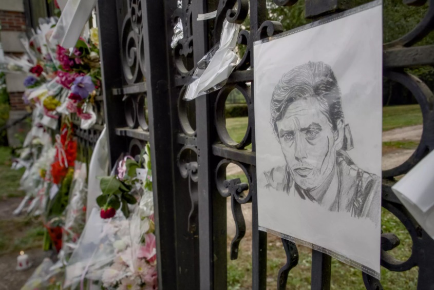Flowers and a portrait of Alain Delon are laid in front of the actor's house in the French village of Douchy where he died on Sunday. (AFP) Flowers and a portrait of Alain Delon are laid in front of the actor's house in the French village of Douchy where he died on Sunday. (AFP)