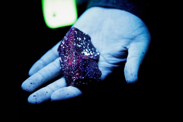 Tungsten is illuminated with mineral light in a mine in Gangwon Province, South Korea, March 31, 2022. REUTERS/ Heo Ran/File Photo