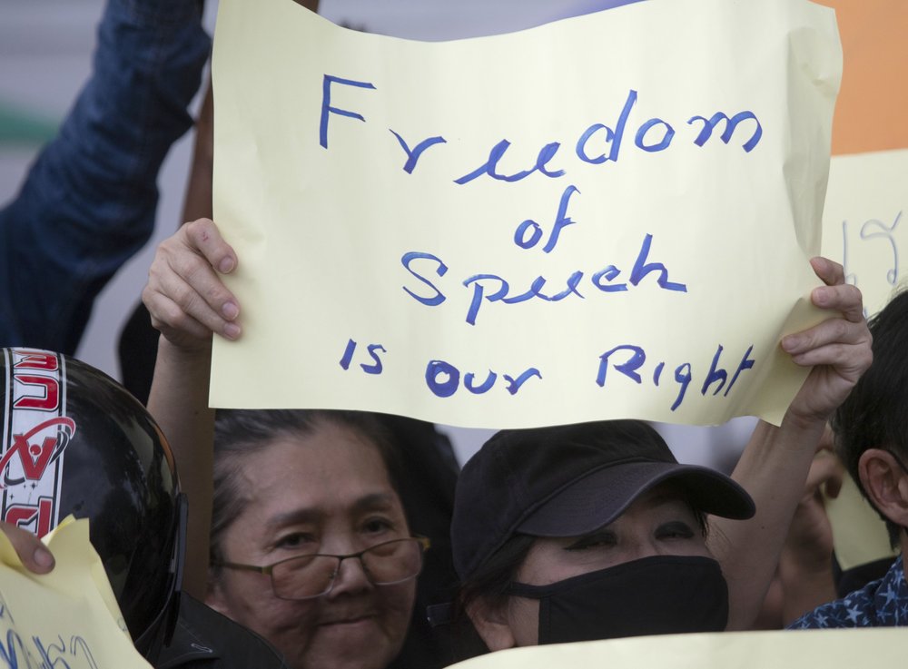 A pro-democracy protester holds up a poster during a rally in Bangkok, Thailand, Sunday.