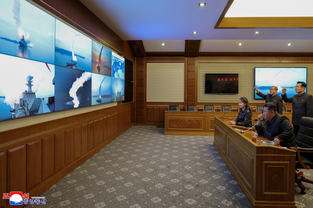 North Korean leader Kim Jong Un and his daughter Kim Ju Ae observe a missile test launch conducted by the Choe Hyon naval destroyer at an unknown location in North Korea, March 10, 2026. (Reuters/File)