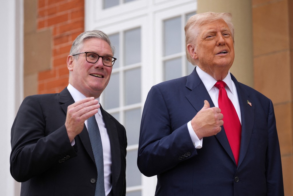 U.S. President Donald Trump and British Prime Minister Keir Starmer react as they meet at Trump Turnberry golf club on July 28, 2025 in Turnberry, Scotland, Britain. (Reuters)