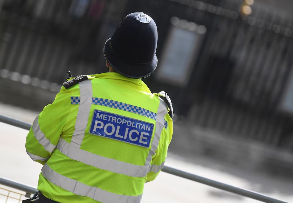 A Metropolitan Police officer stands on duty in Westminster, London, Britain, October 1, 2021. REUTERS/Toby Melville