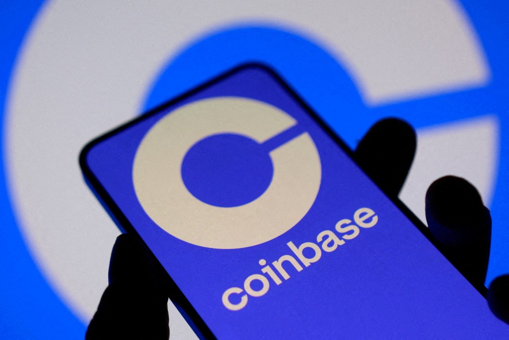 The Coinbase logo on a smartphone screen in this illustration taken November 3, 2025. REUTERS/Dado Ruvic