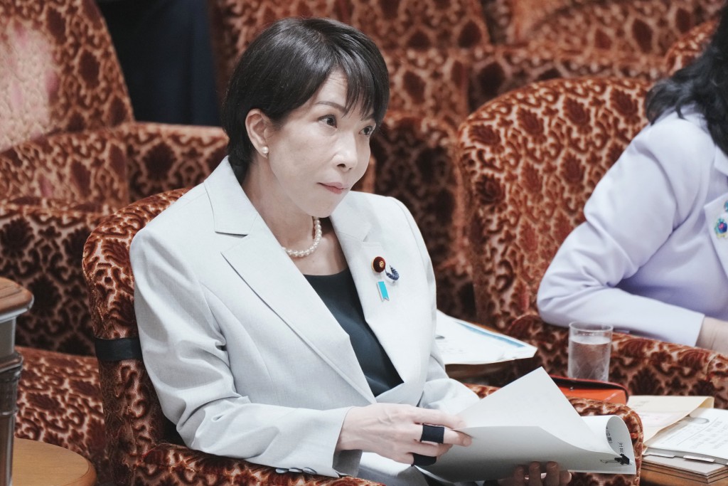 Japan's Prime Minister Sanae Takaichi listens to a question about the situation in the Middle East during a budget committee session of the House of Councillors at Parliament in Tokyo on April 7, 2026. (Photo by Kazuhiro NOGI / AFP)
