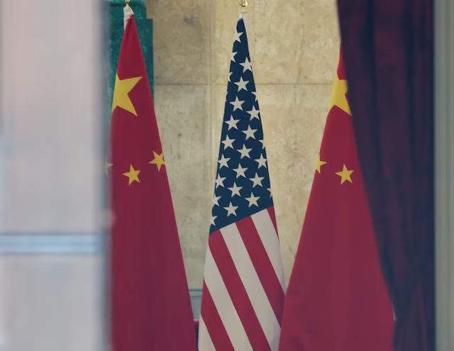 U.S. and China flags are pictured at Lancaster House in London, Britain, June 10, 2025. REUTERS/Toby Melville