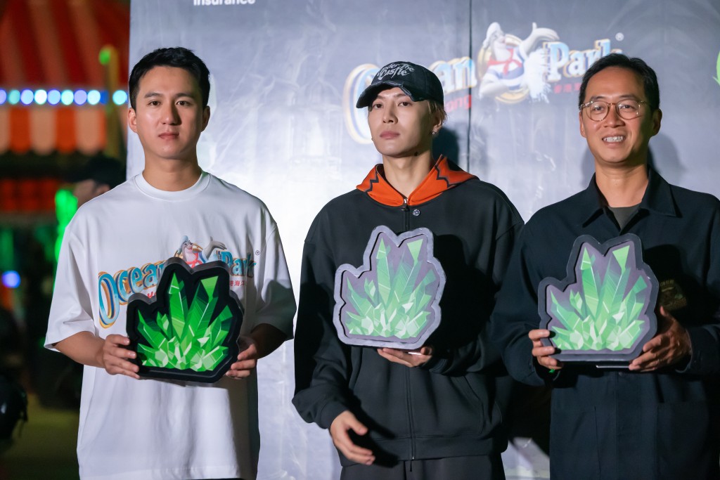 Jackson Wang poses for a photo with guests during the lighting ceremony at Ocean Park.