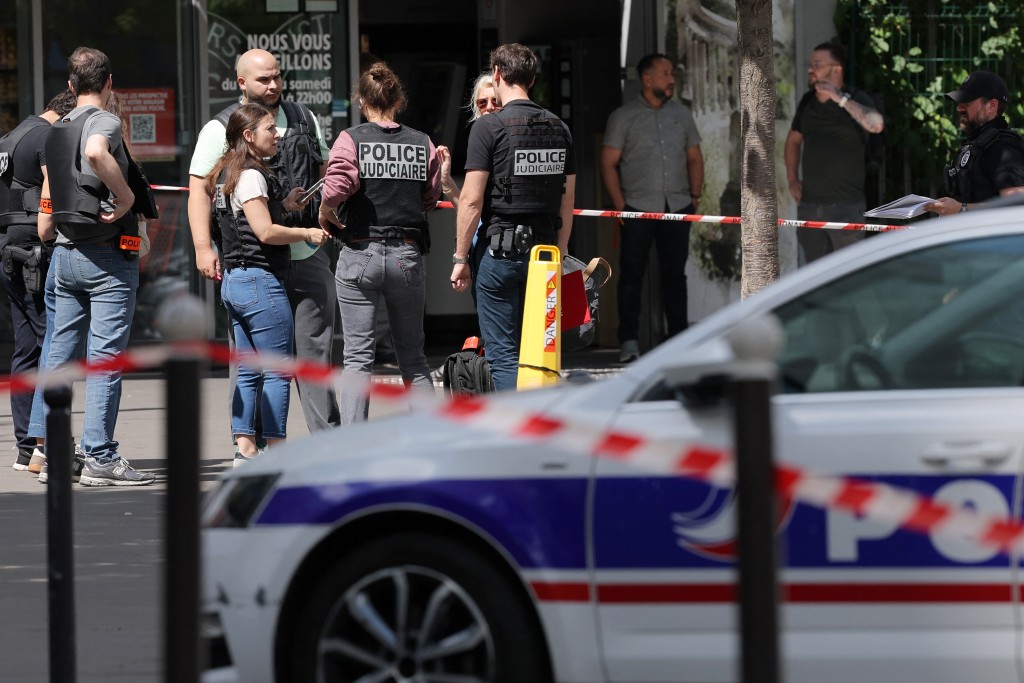 Judicial police work in a cordoned off area after a knife-wielding man wounded three people in Paris on July 27, 2026. (AFP)
