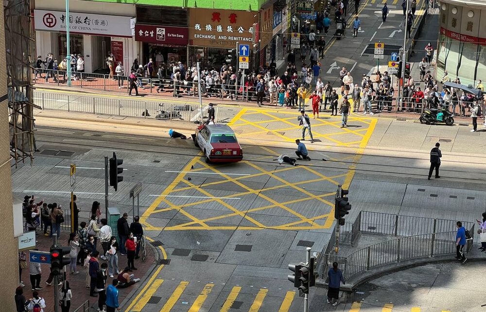 Two of the victims were seriously injured. Inset: a screen grab of the cab going through a green light. Two of the victims were seriously injured. Inset: a screen grab of the cab going through a green light.